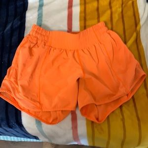 size 4 lululemon orange hotty hot shorts